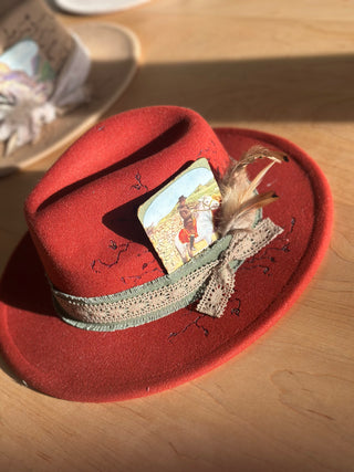 Crimson red hat with vintage litho card