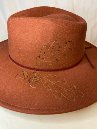 Oak leaf and acorn on rust hat