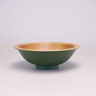 Grungy green-over-black decorative bowl